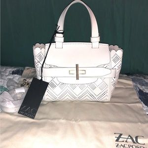 Authentic ZAC Zac Posen
Brigette Perforated Belted Mini Crossbody Bag
